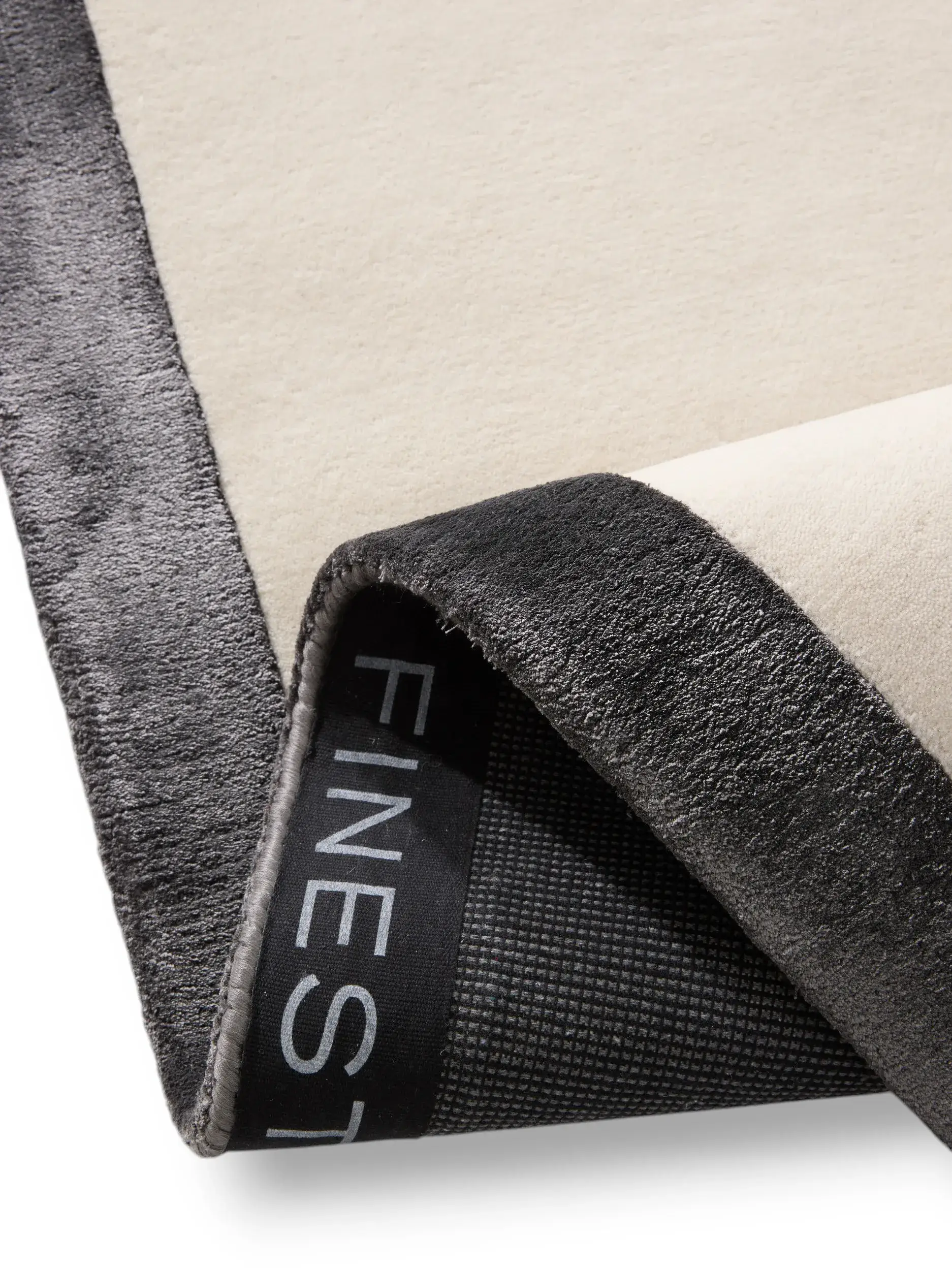 Rug made of 80% Wool, 20% Lyocell (Tencel™) in Black/White with a 80% Wool, 20% Lyocell (Tencel™) high pile by benuta Finest